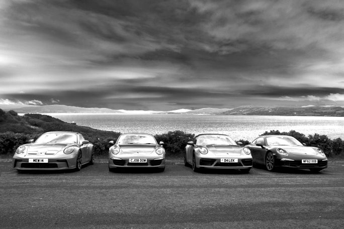 4 Porsche 911 in a row in high contrast monochrome, by Denis Taylor 