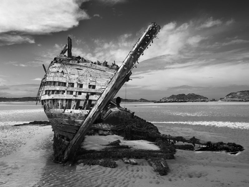 'Bád Eddie'. Matheraclogher Beach Ship wreck on Matheraclogher beach, by Denis Taylor