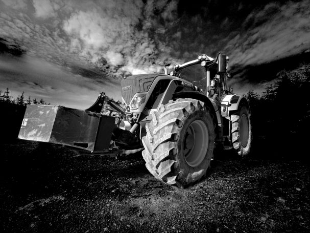Monochrome Fendt Tractor against a powerful clouded sky, by Denis Taylor
