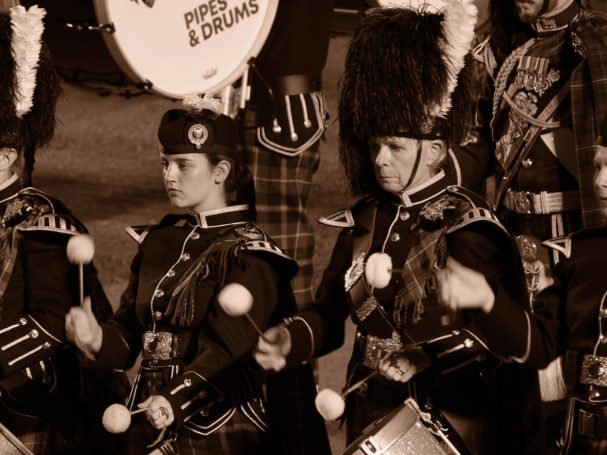 Father and daughter? Two drummers in the pipe band at the Edinburgh festival looking the picture of concentration, by Denis Taylor