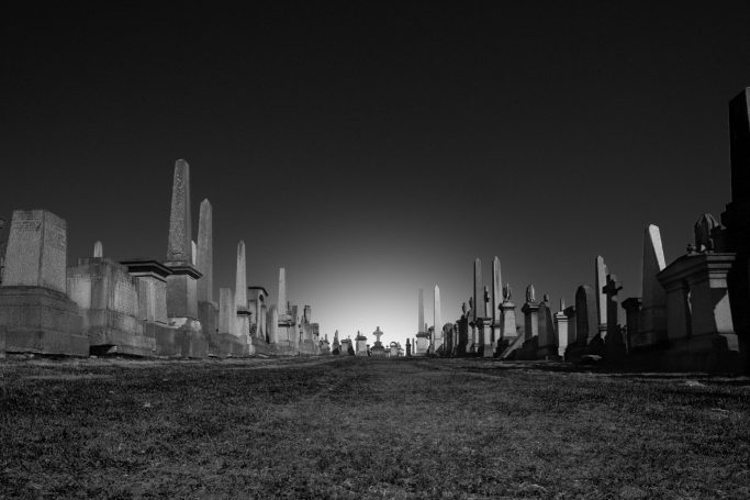 Glowing Cross Cemetery with glowing sunset , by Denis Taylor